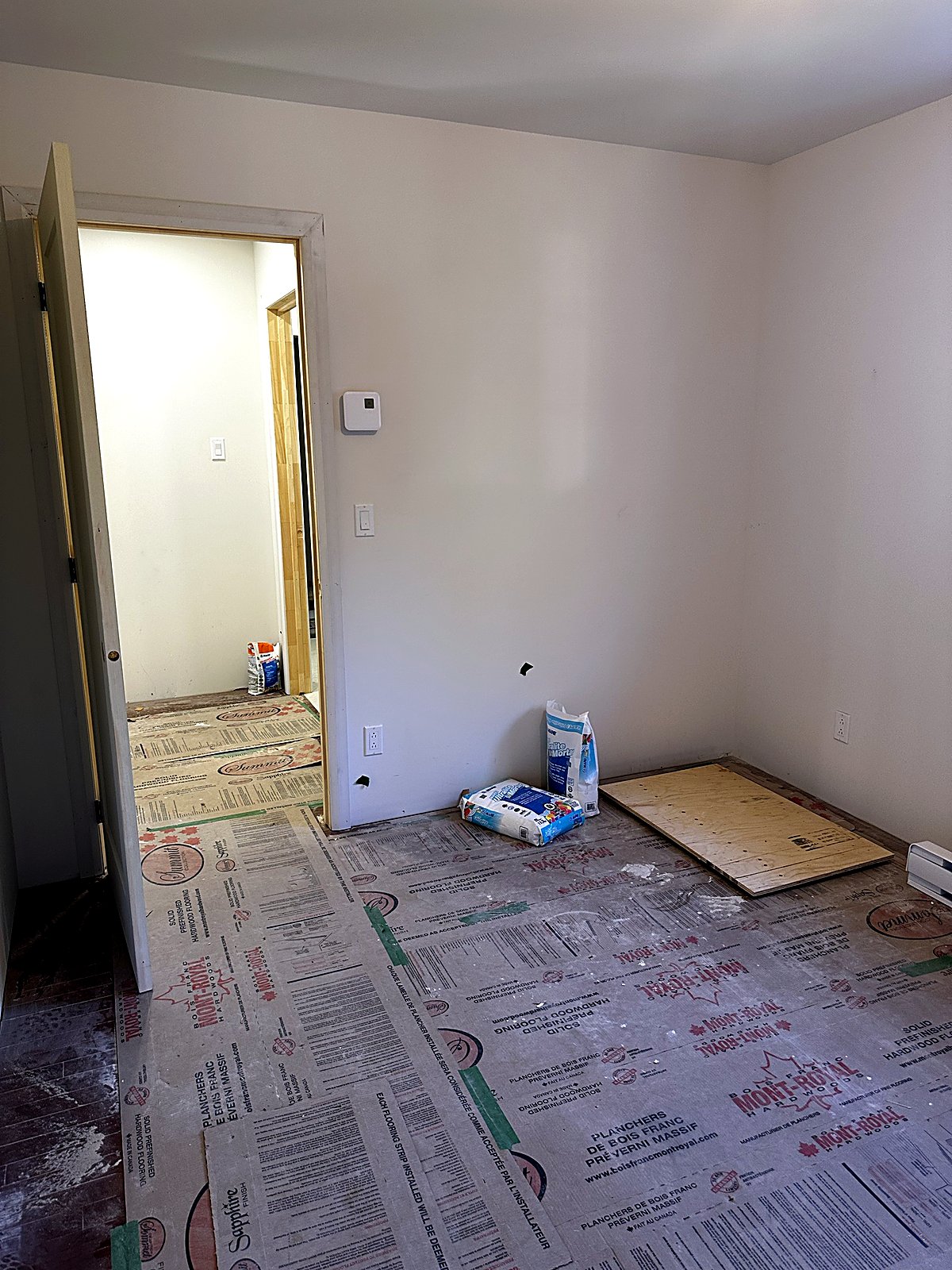 New bedroom in a second-storey addition with doors and trim installed