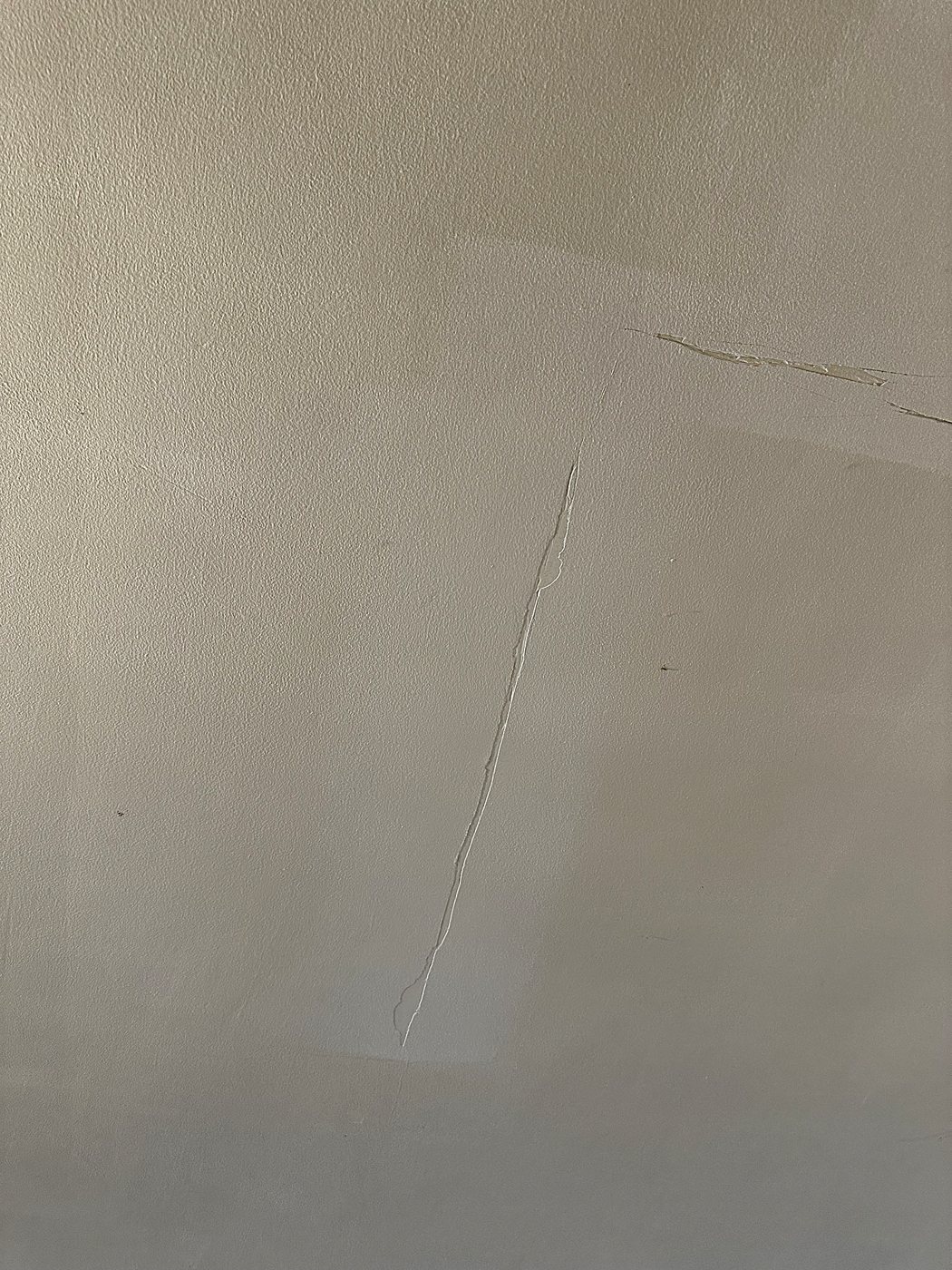 Cracked plaster before repair – full home renovation in Hudson by Buildrex Construction